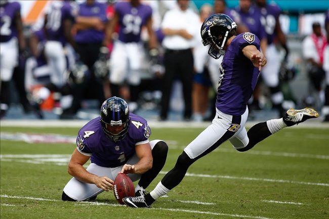 Justin Tucker kicking a game winning field goal.